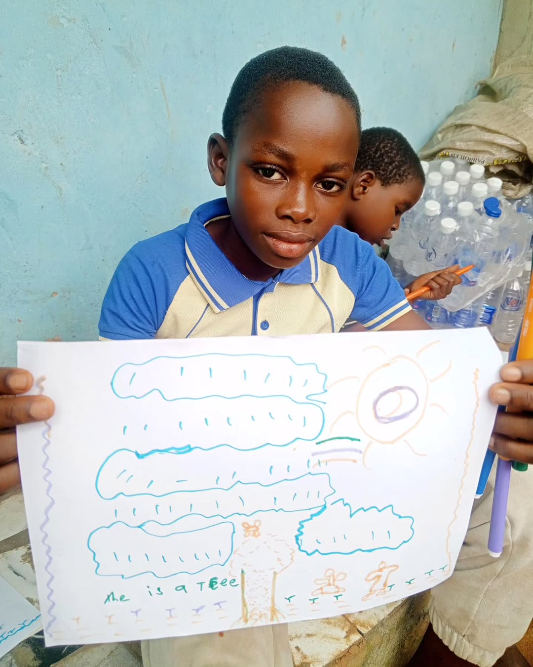 Children receiving books from CHASOF